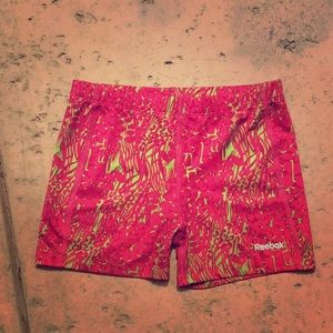 Pink and green Reebok spandex